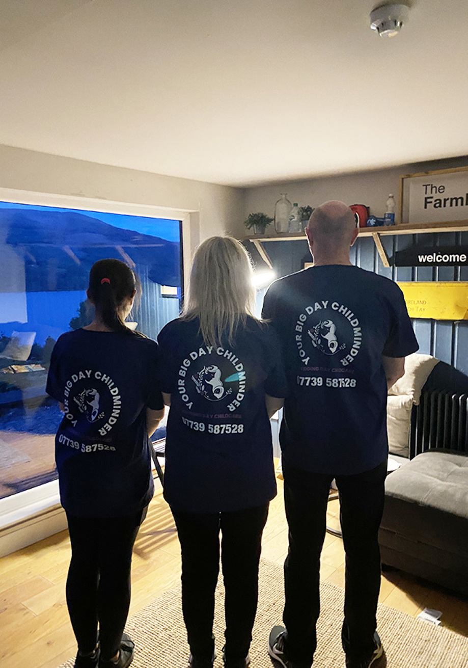 Three childcare workers in uniform t-shirts